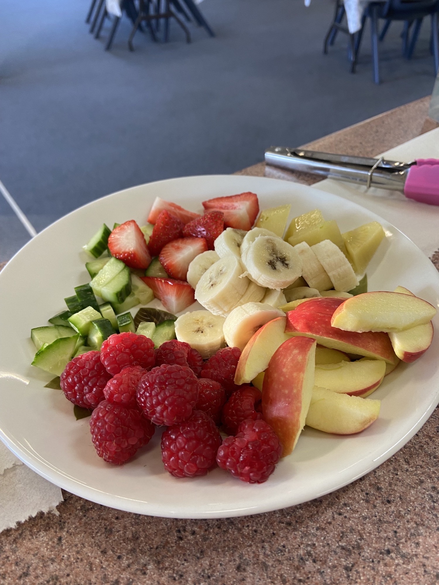 plate of strawberries, fresh apple slices and bananas